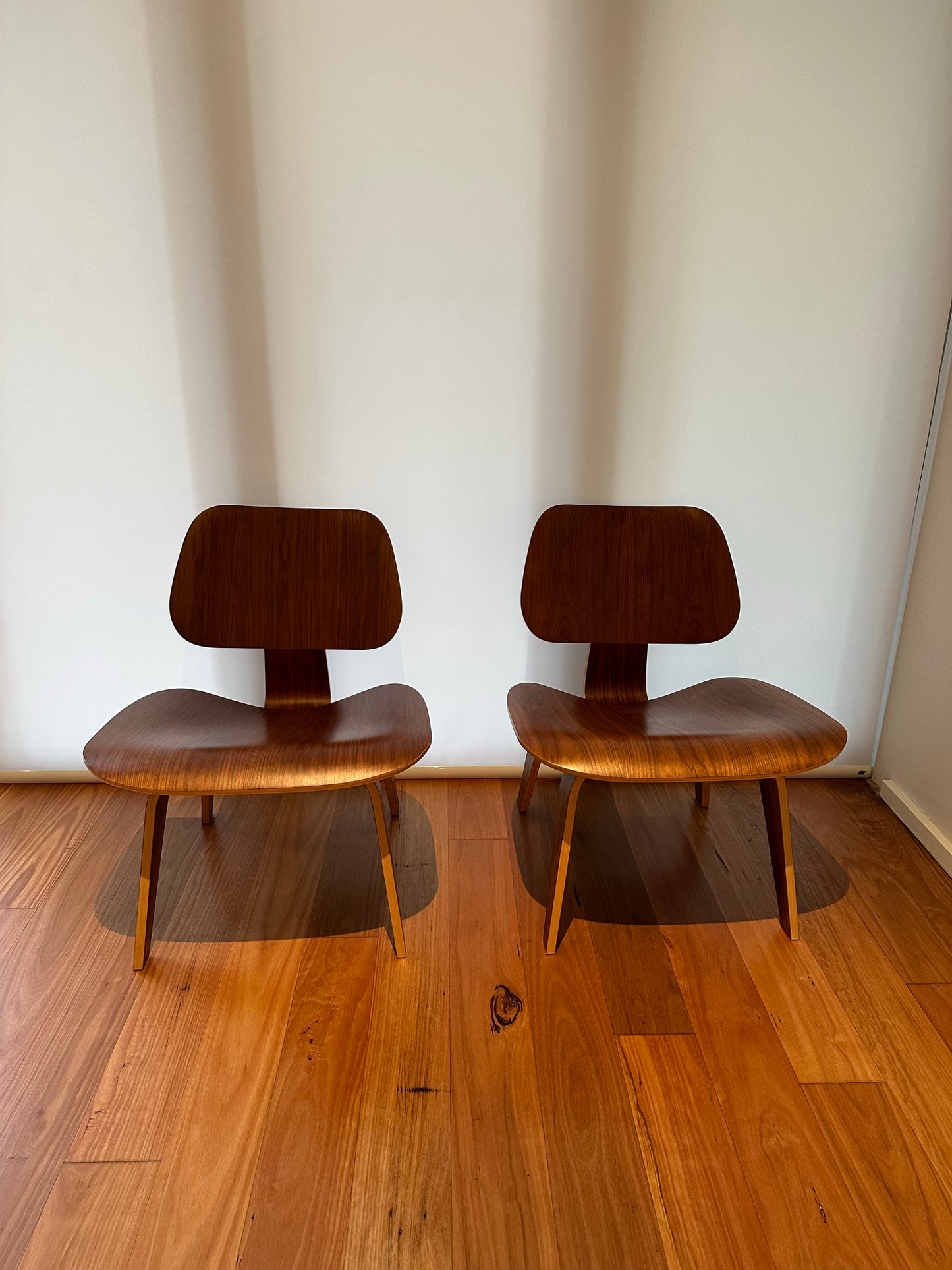 - Set of Two Herman Miller Eames LCW Walnut Lounge Chairs