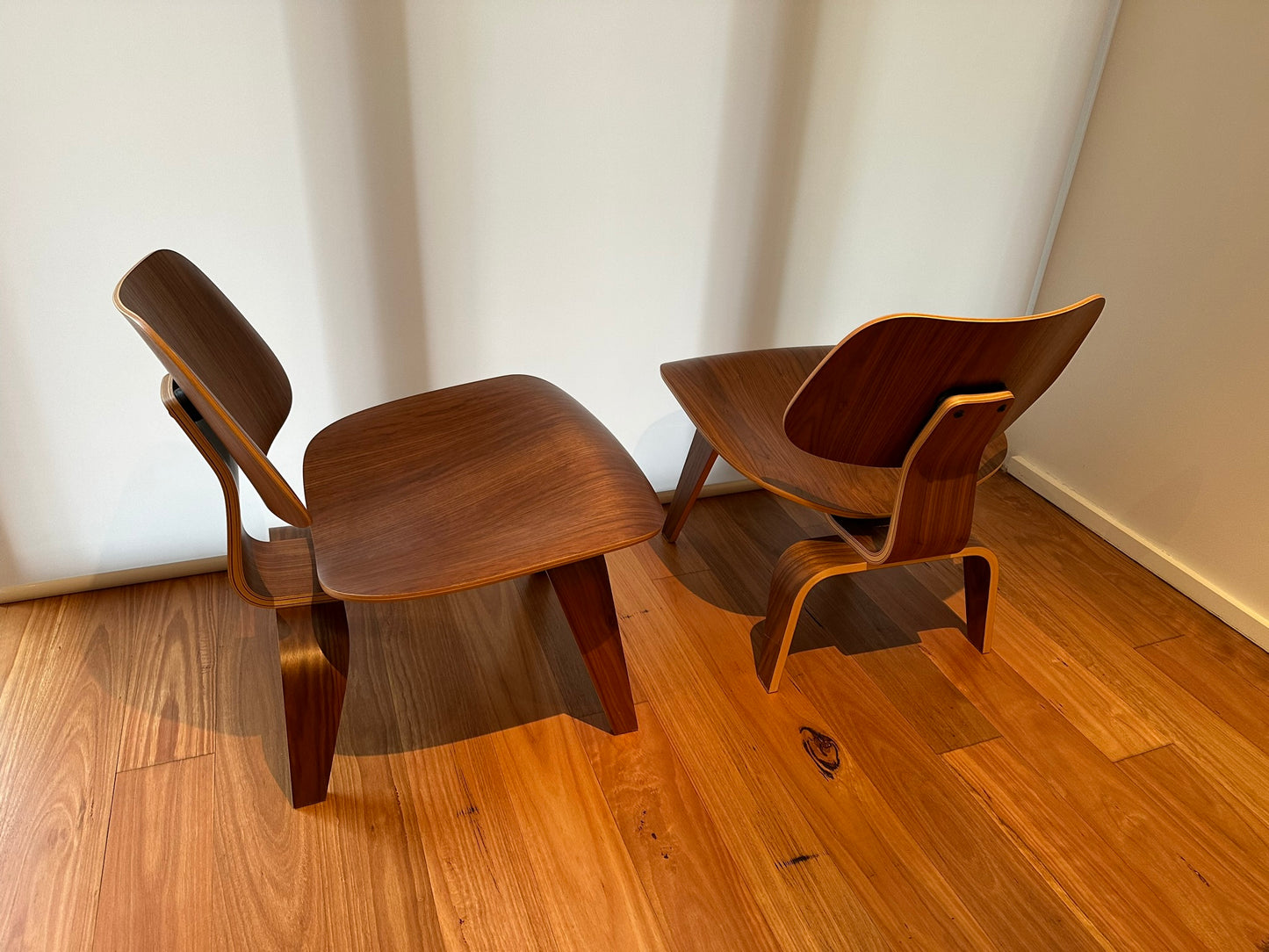 - Set of Two Herman Miller Eames LCW Walnut Lounge Chairs