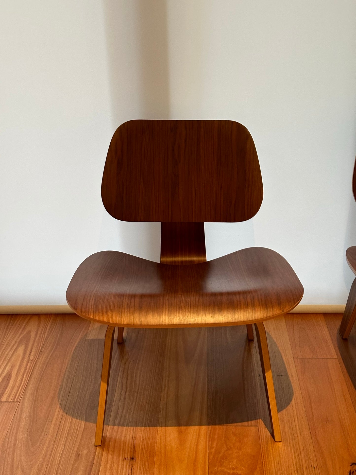 - Set of Two Herman Miller Eames LCW Walnut Lounge Chairs
