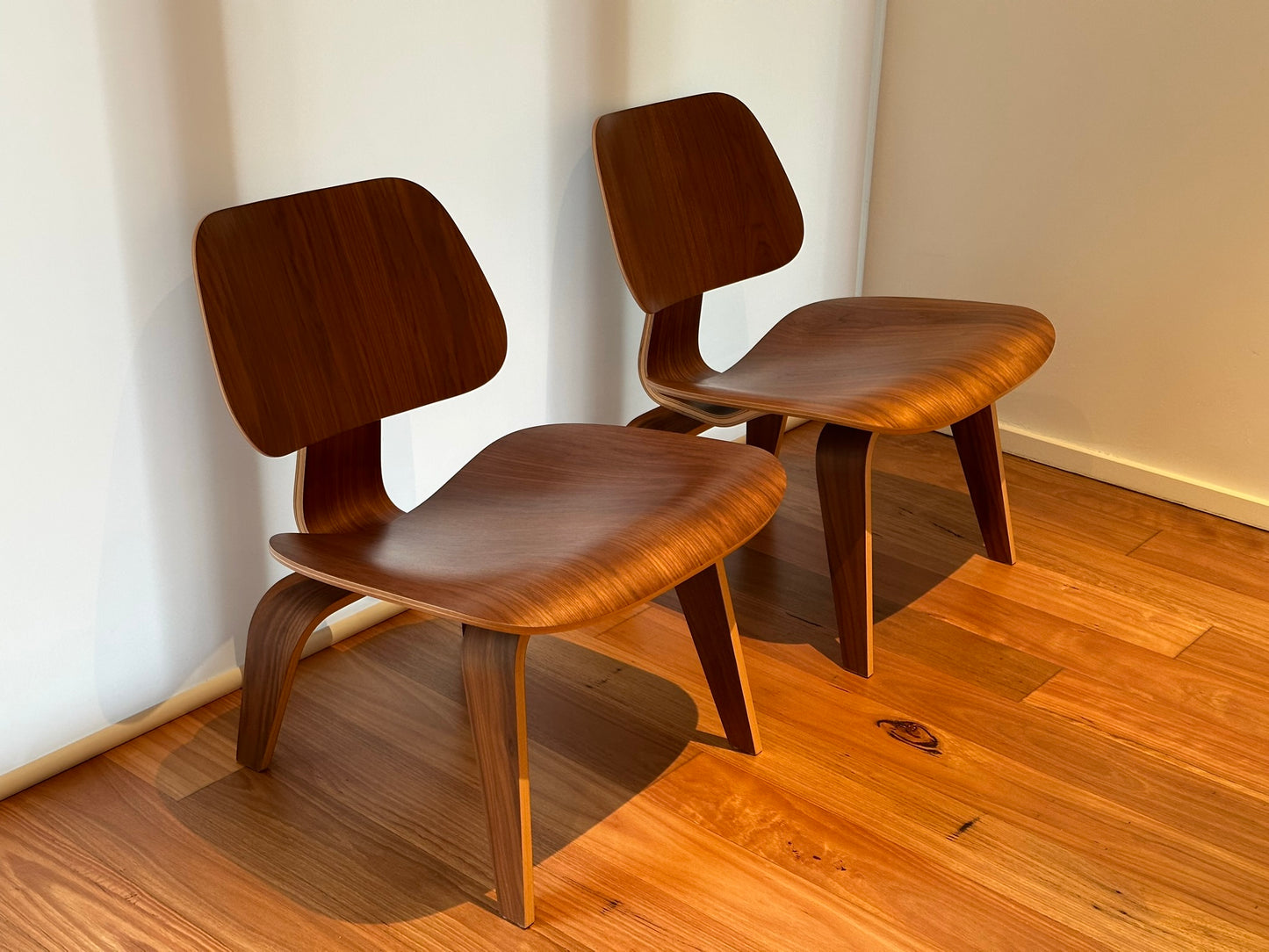 - Set of Two Herman Miller Eames LCW Walnut Lounge Chairs