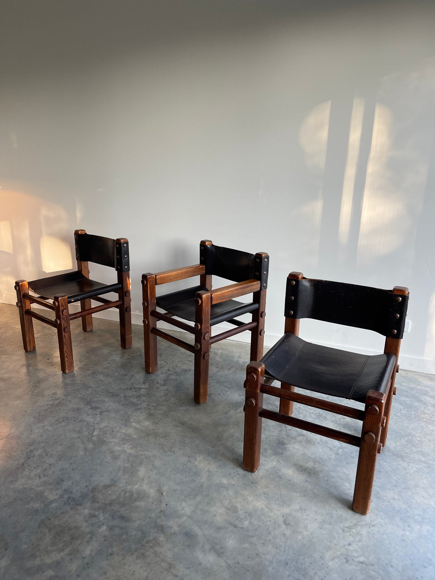 - Pair of Norman Archibald Nore Leather Dining Chairs