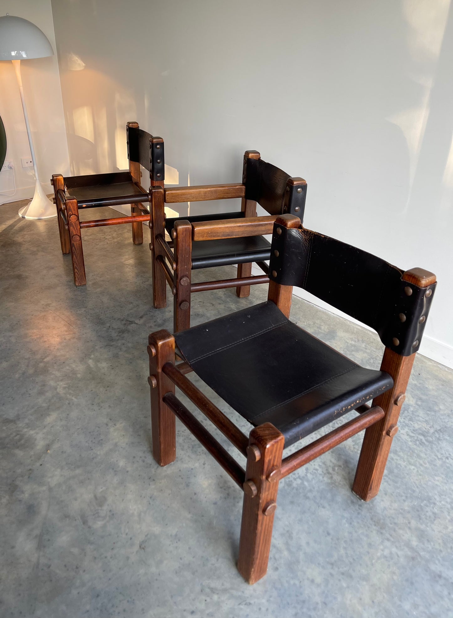 - Pair of Norman Archibald Nore Leather Dining Chairs