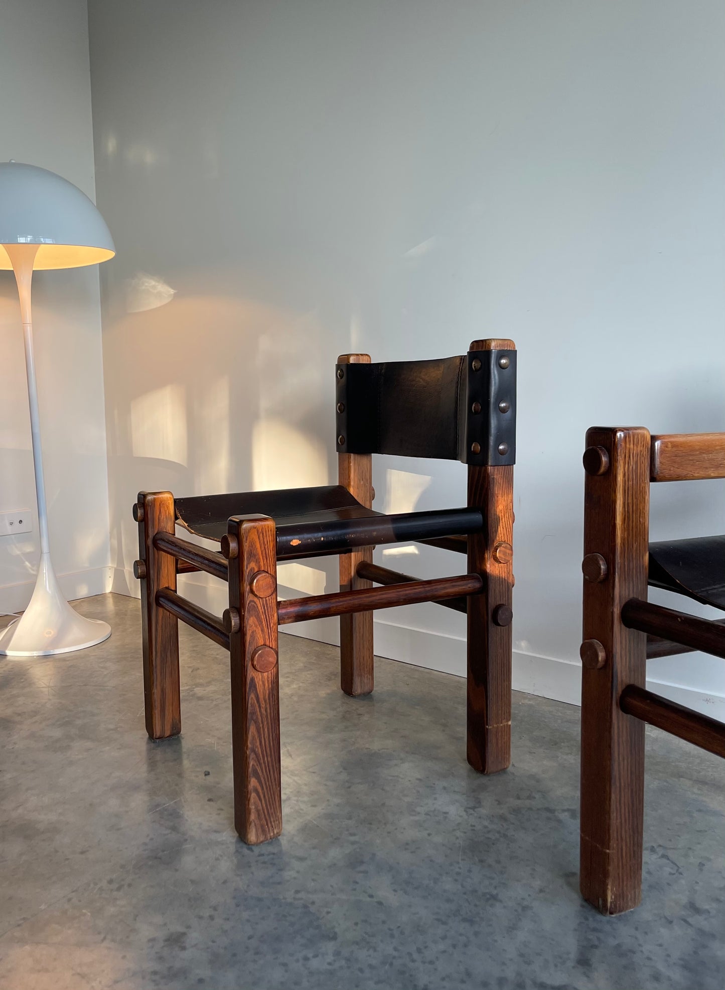 - Pair of Norman Archibald Nore Leather Dining Chairs