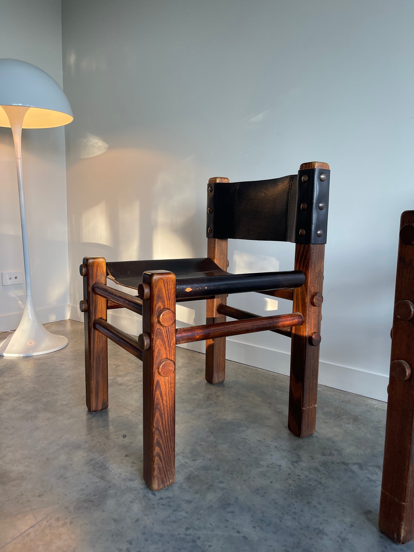 - Pair of Norman Archibald Nore Leather Dining Chairs
