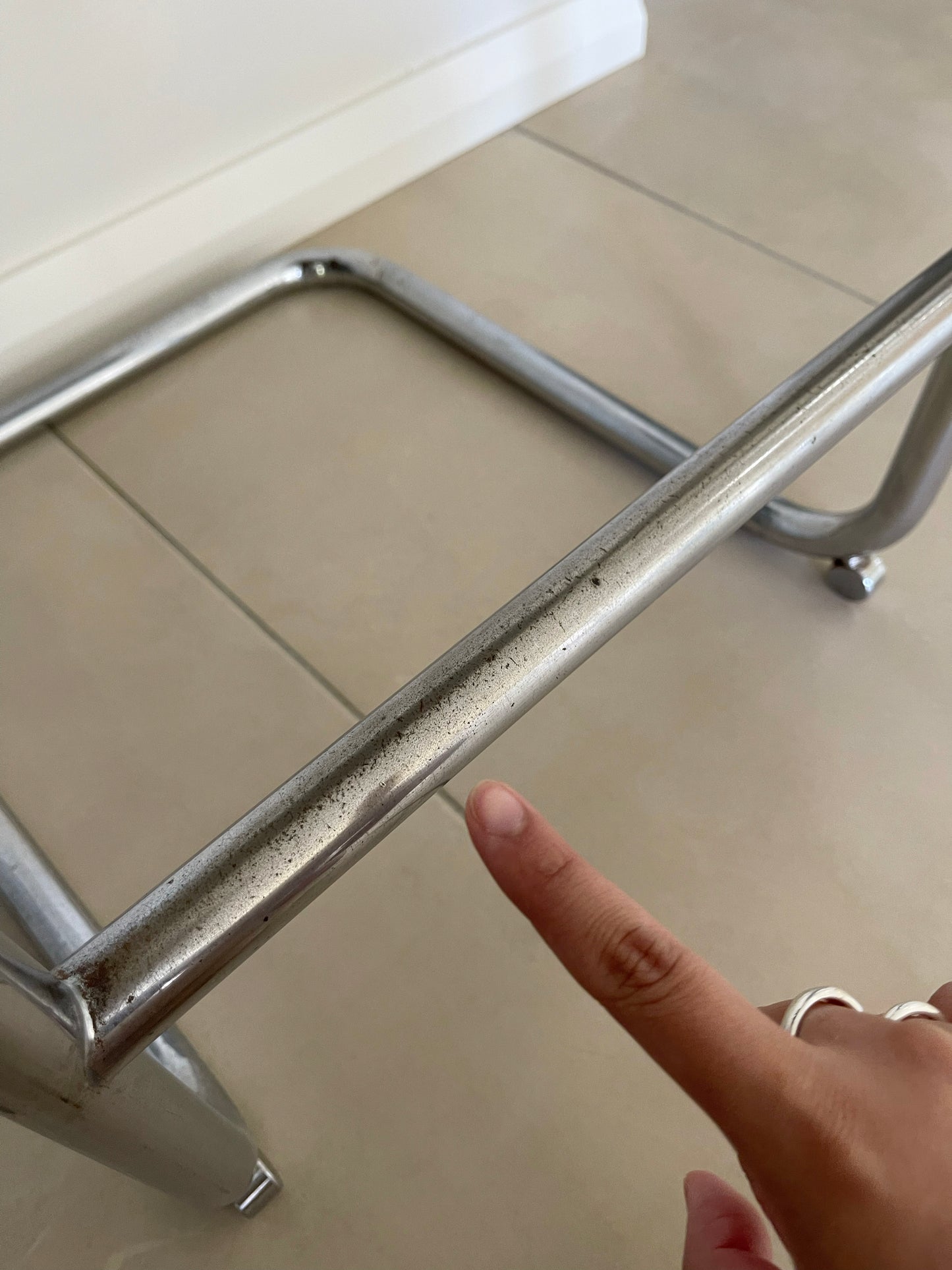 - Pair of Black Leather and Chrome Cantilever Bar Stools