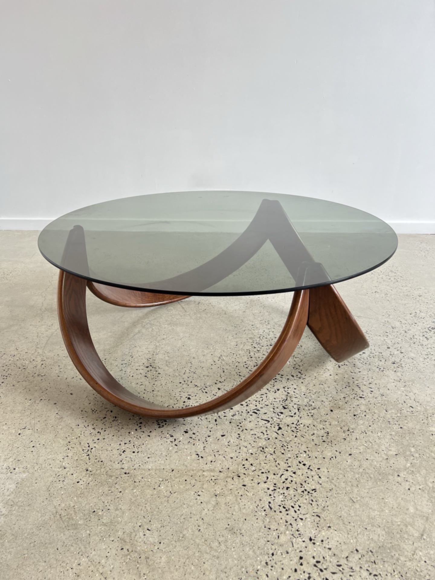 - Italian Mid Century Modern Beechwood Curved Base with Smoked Glass Coffee Table