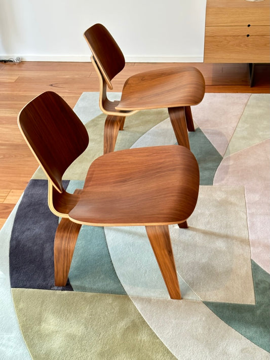 - Set of Two Herman Miller Eames LCW Walnut Lounge Chairs