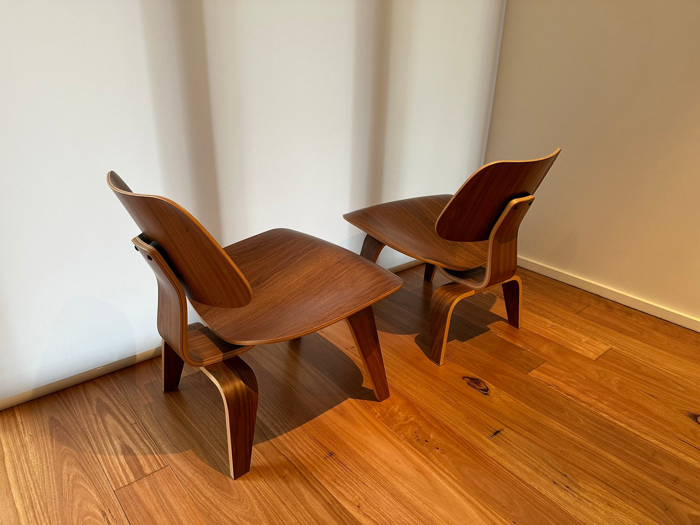 - Set of Two Herman Miller Eames LCW Walnut Lounge Chairs
