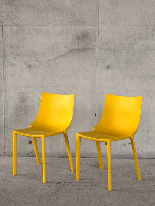 A pair of BO stackable chairs by Driade, Italy