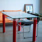Postmodern Glass Dining Table with Red Lacquered Legs Italy