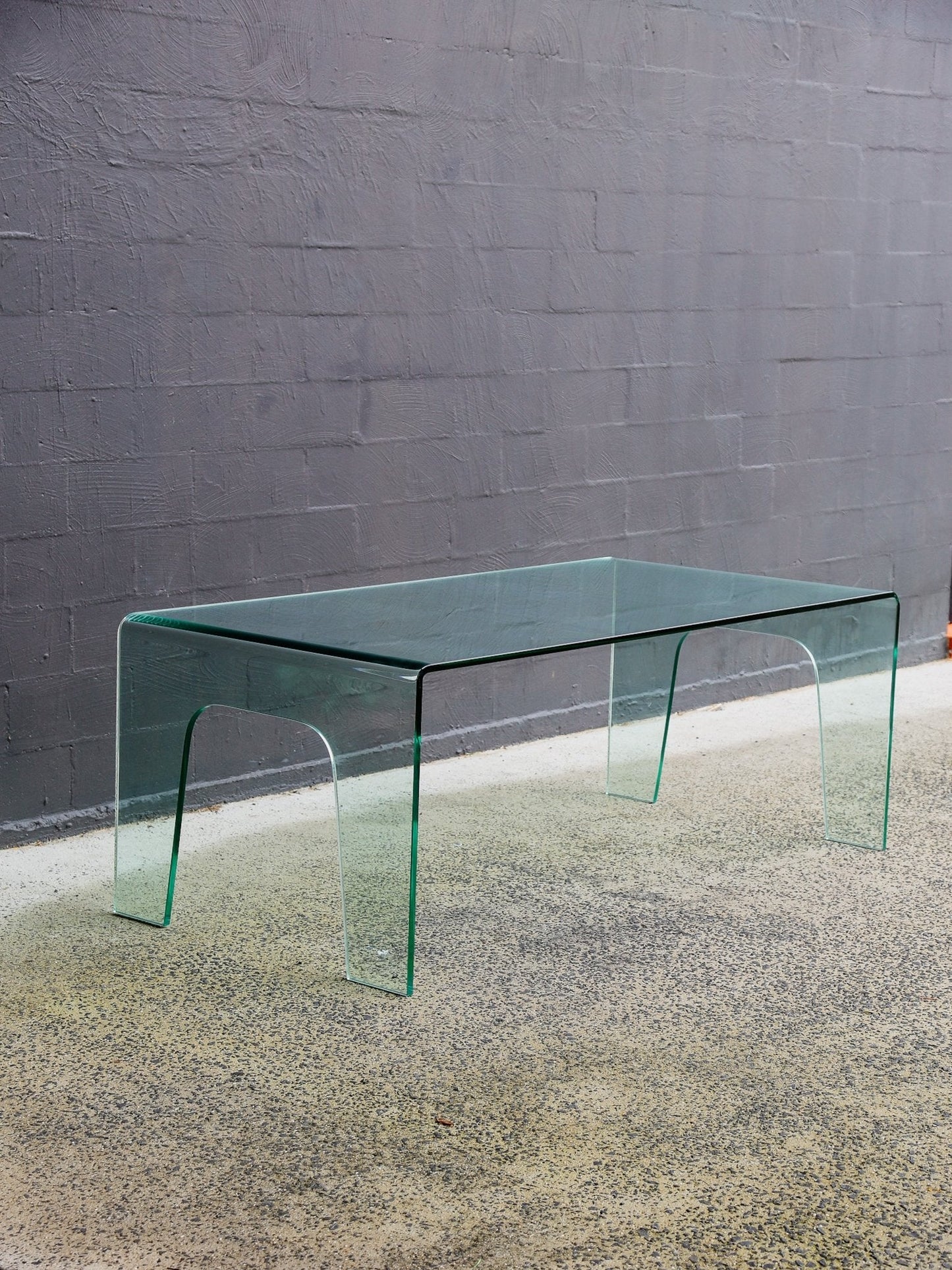 FIAM Italy Curved Glass Waterfall Table