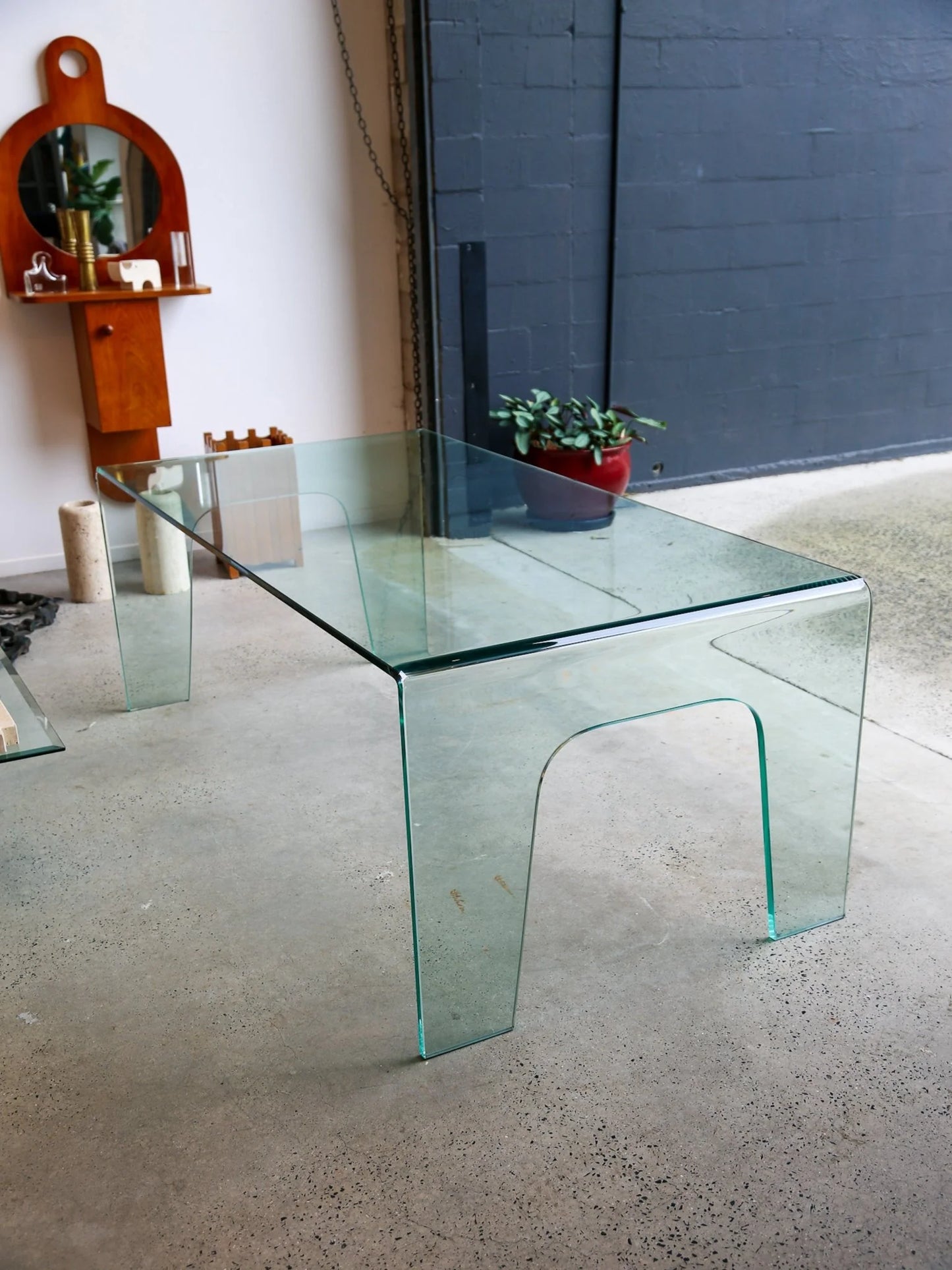 FIAM Italy Curved Glass Waterfall Table
