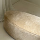 - Curved Ottoman in Cashew Velvet