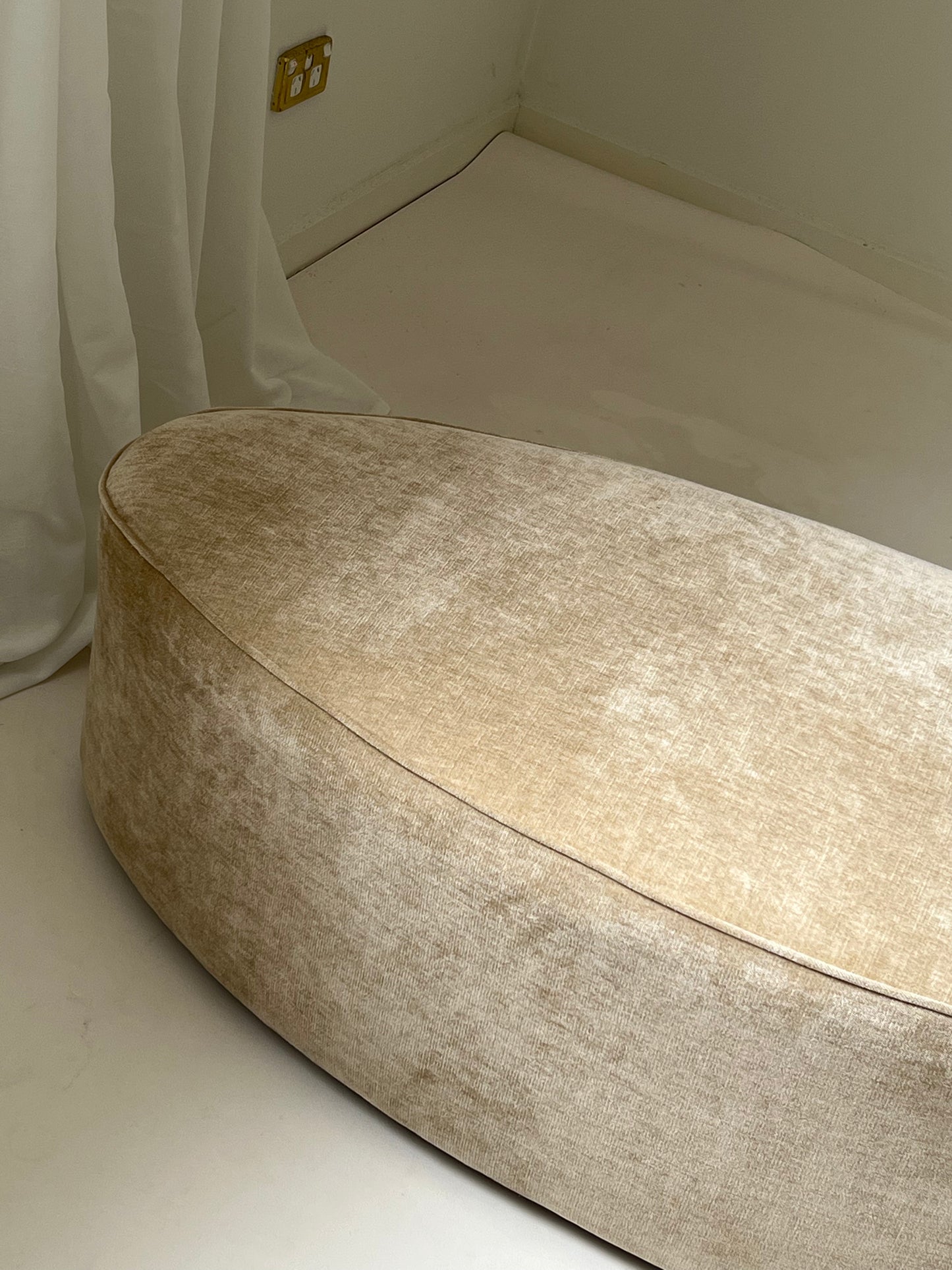 - Curved Ottoman in Cashew Velvet
