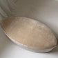 - Curved Ottoman in Cashew Velvet