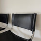 - Pair of Black Leather and Chrome Cantilever Bar Stools
