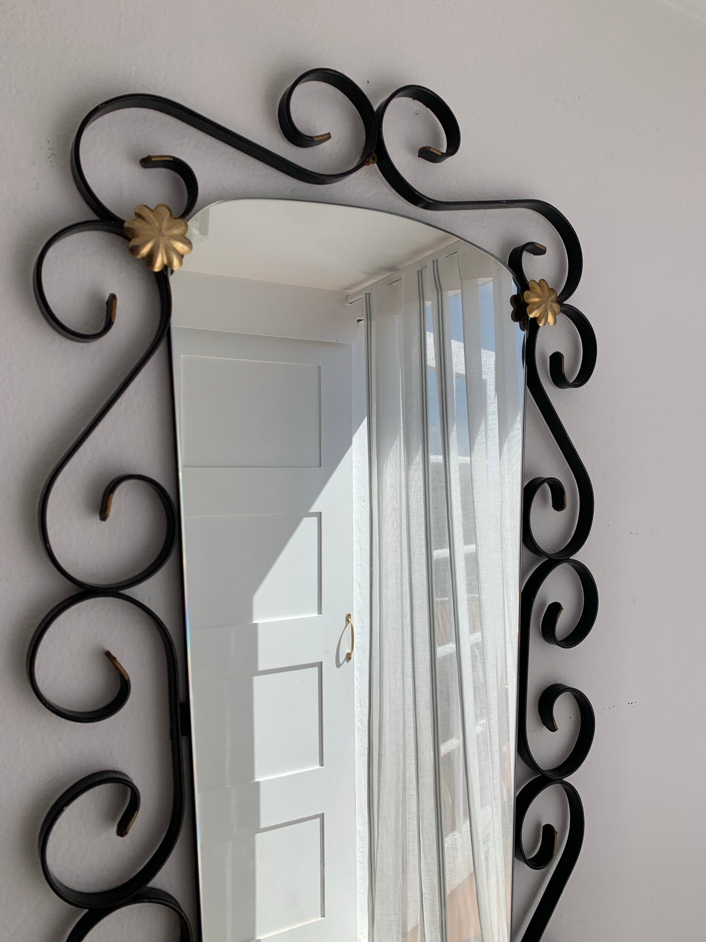French Curved Iron and Brass Mirror