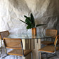 Unfilled travertine dining table with glass top