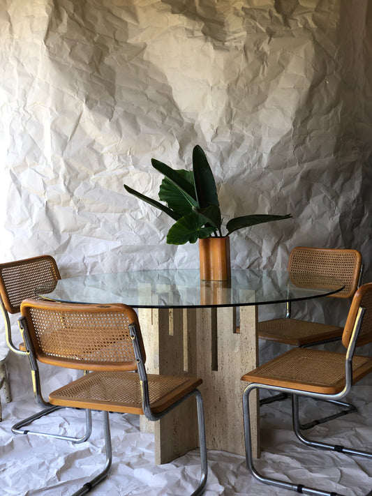 Unfilled travertine dining table with glass top