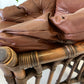 Vintage Cane and Leather Armchair + Ottoman
