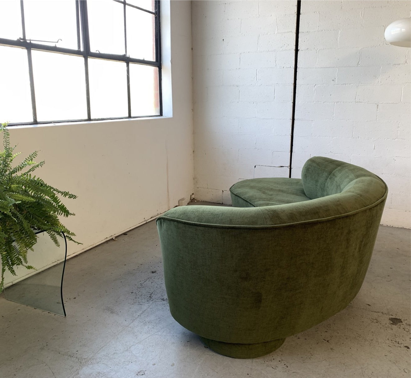 Curved Velvet Sofa in Deep Botanical Green