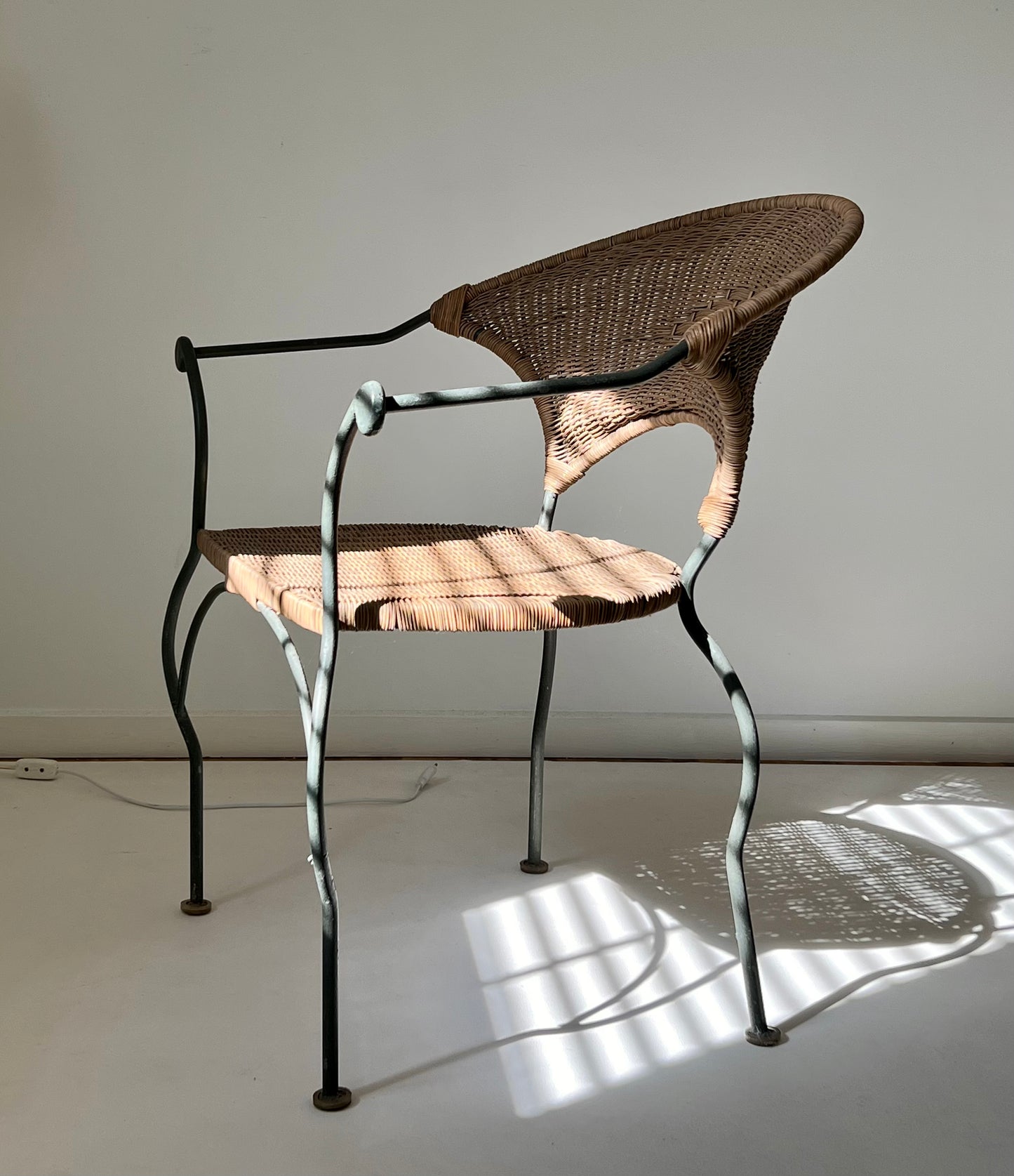- Curvy Iron and Cane Armchair