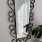 French Curved Iron and Brass Mirror