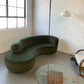 Curved Velvet Sofa in Deep Botanical Green