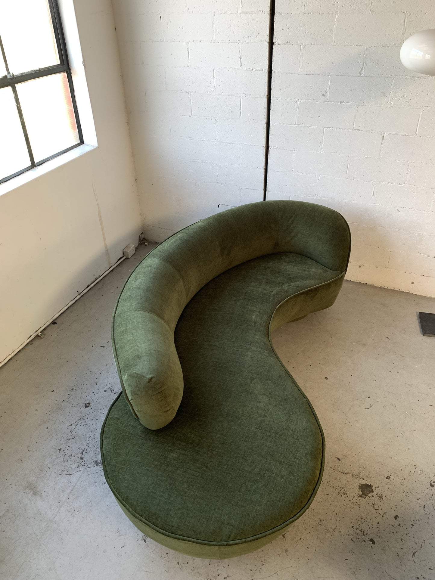 Curved Velvet Sofa in Deep Botanical Green