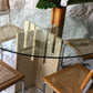 Unfilled travertine dining table with glass top