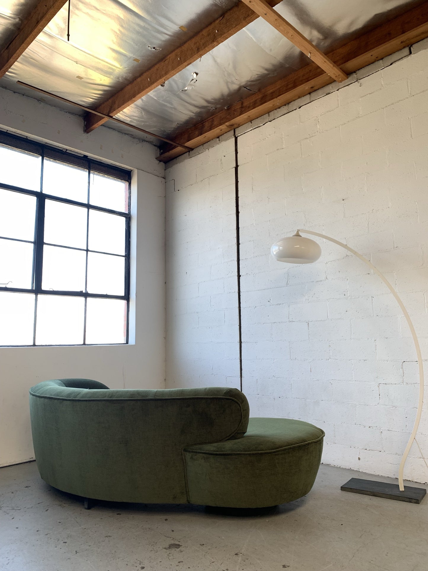 Curved Velvet Sofa in Deep Botanical Green