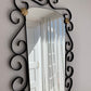French Curved Iron and Brass Mirror