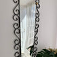 French Curved Iron and Brass Mirror