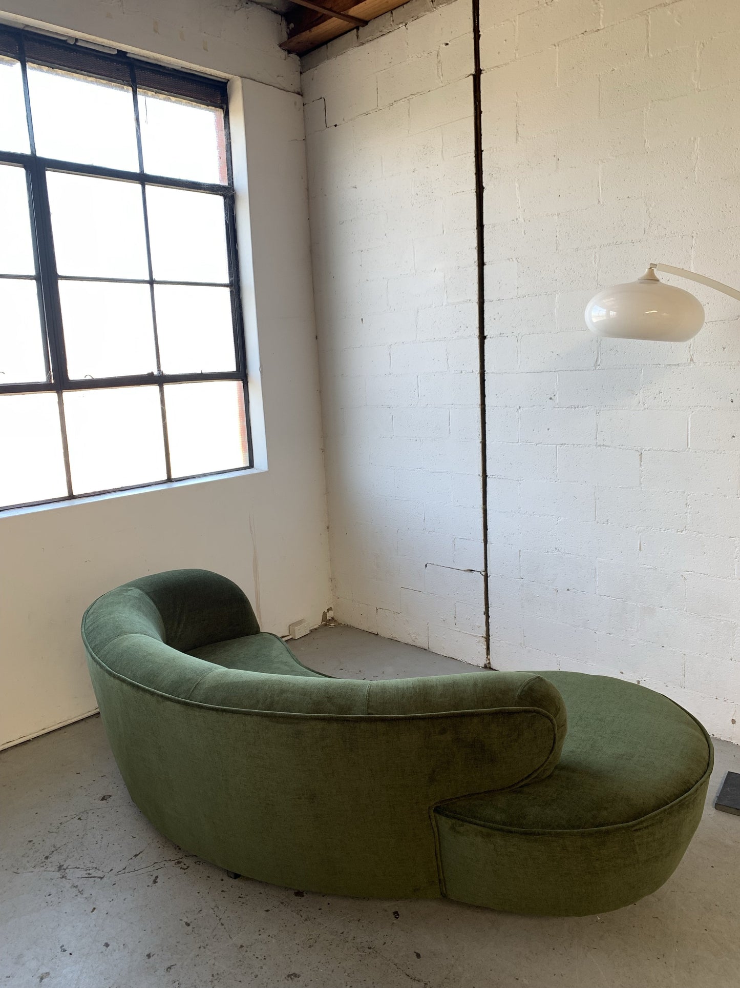 Curved Velvet Sofa in Deep Botanical Green