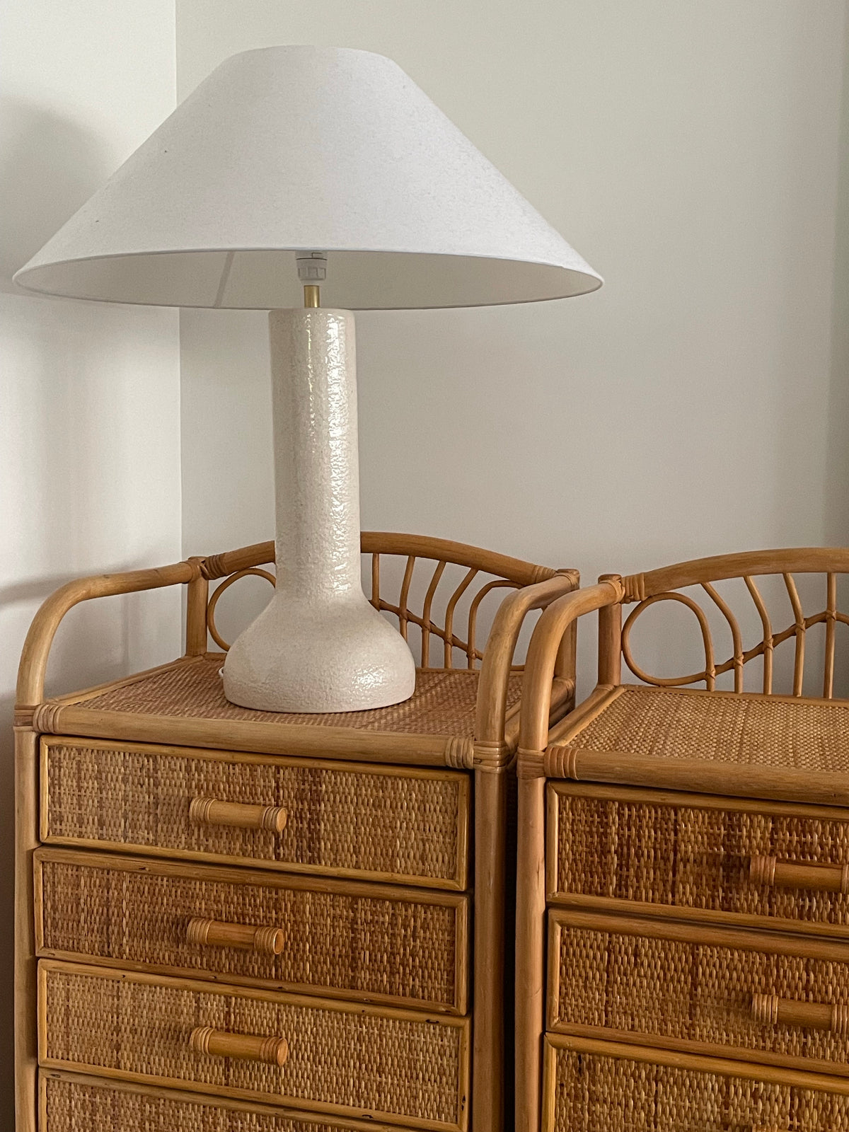 Pair of vintage cane bedside tables