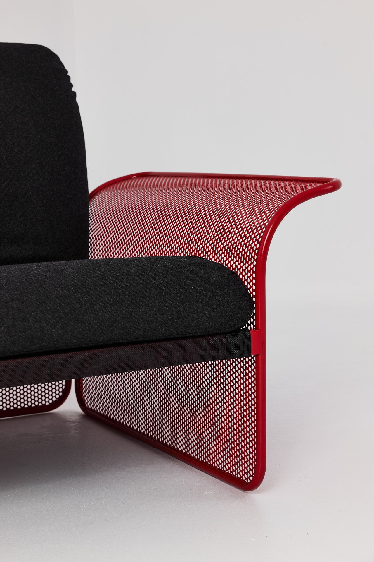 Restored Red perforated steel lounge chair - One available