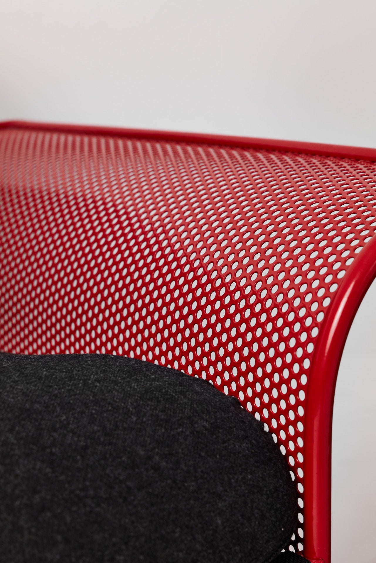 Restored Red perforated steel lounge chair - One available