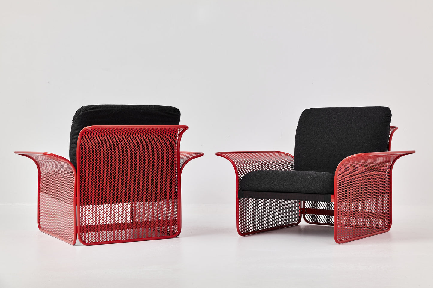 Restored Red perforated steel lounge chair - One available