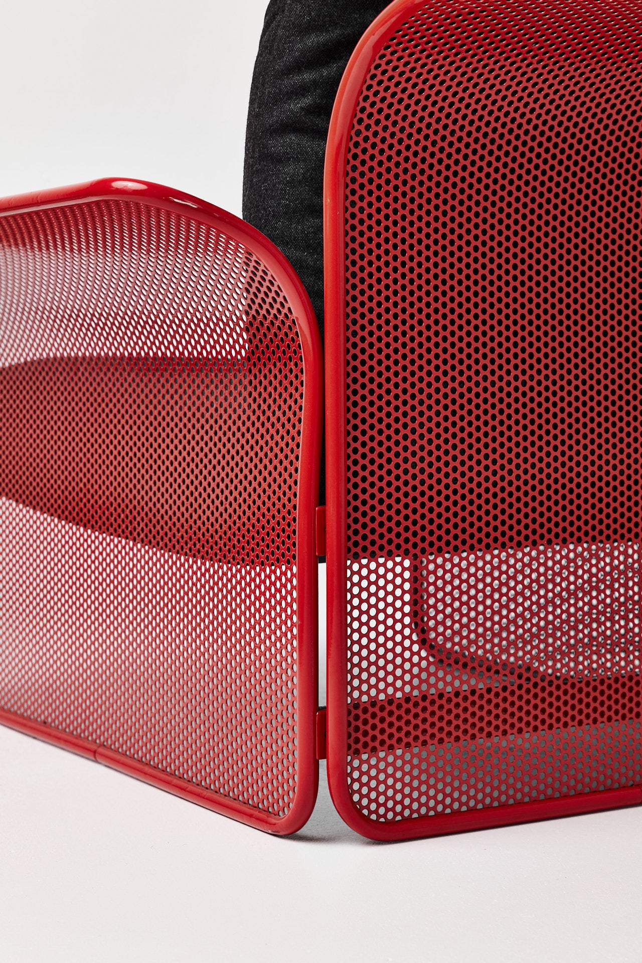 Restored Red perforated steel lounge chair - One available