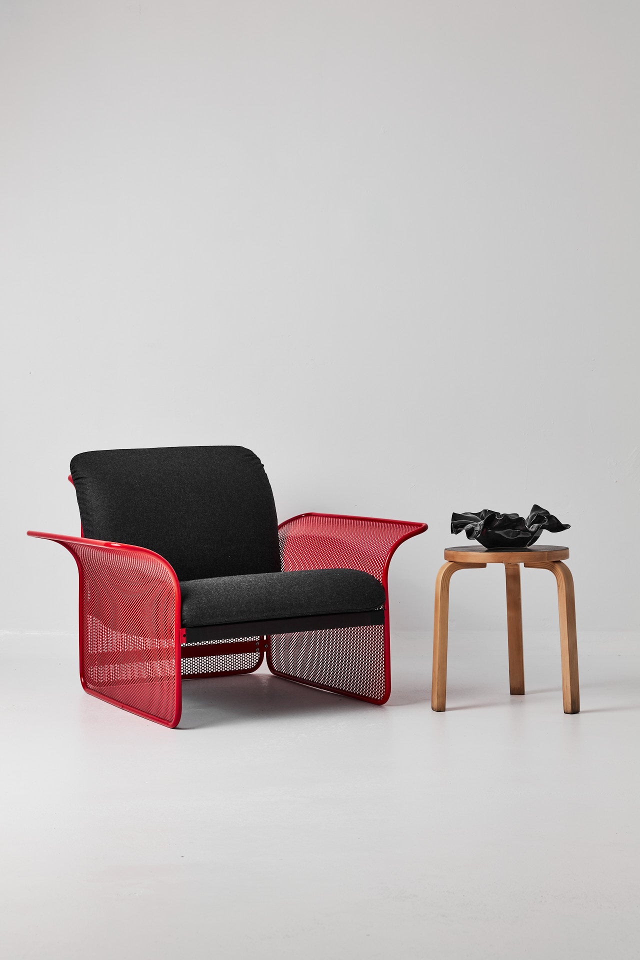 Restored Red perforated steel lounge chair - One available